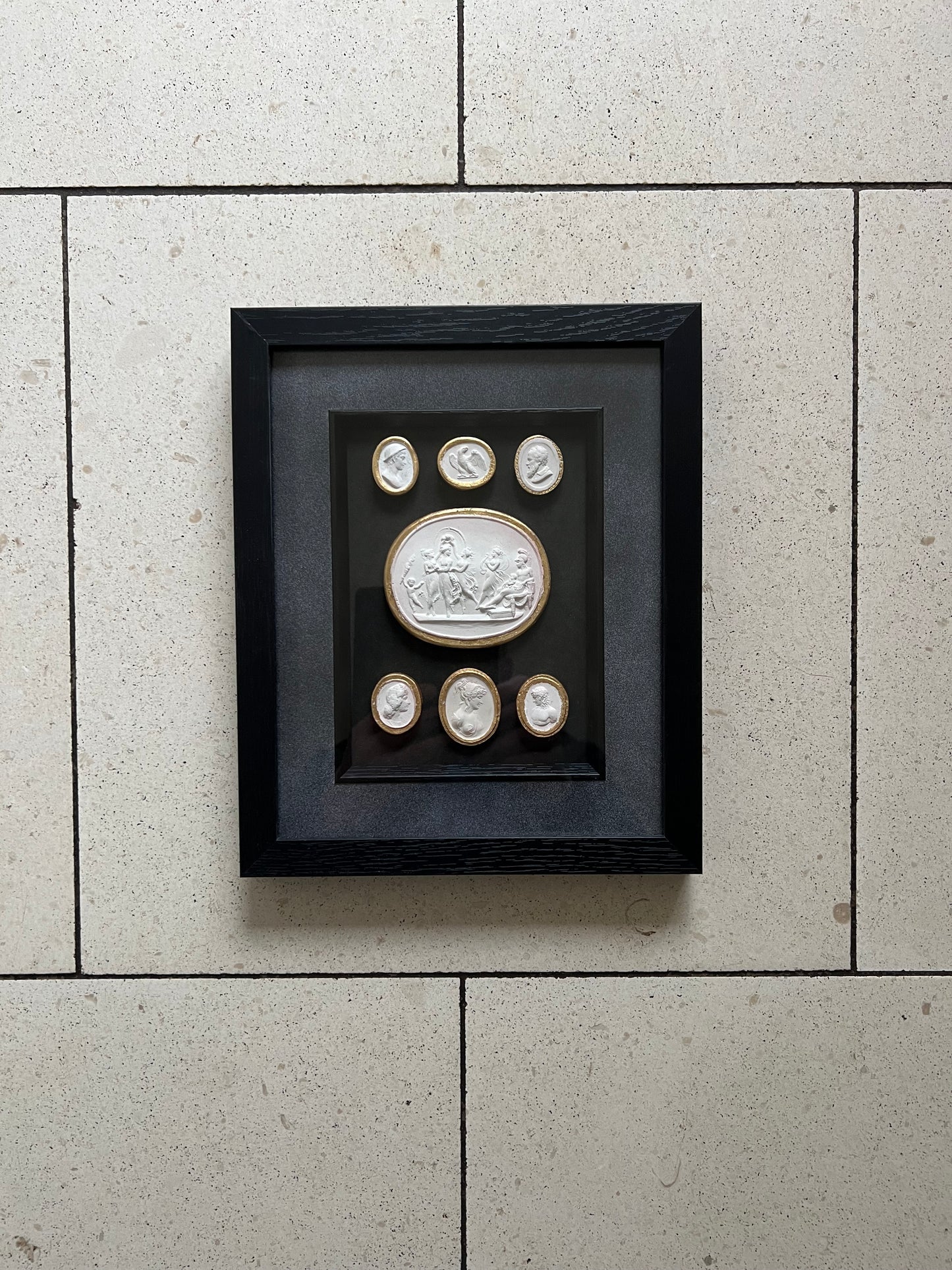 Set of Seven Intaglio's With Gold leaf And Black Frame