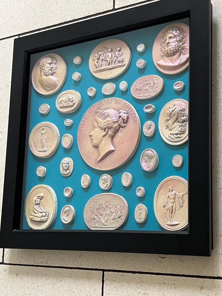 Framed and glazed Intaglios in Pearl on a blue background