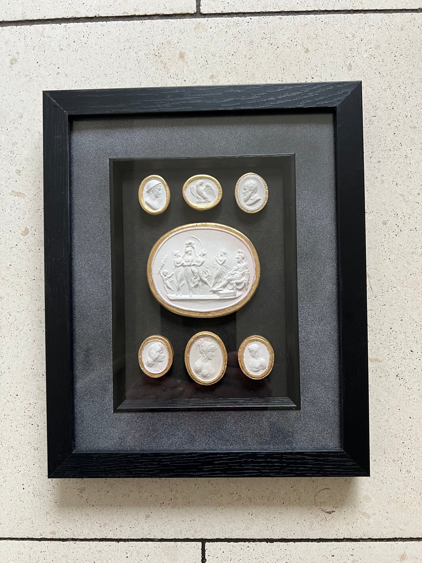 Set of Seven Intaglio's With Gold leaf And Black Frame