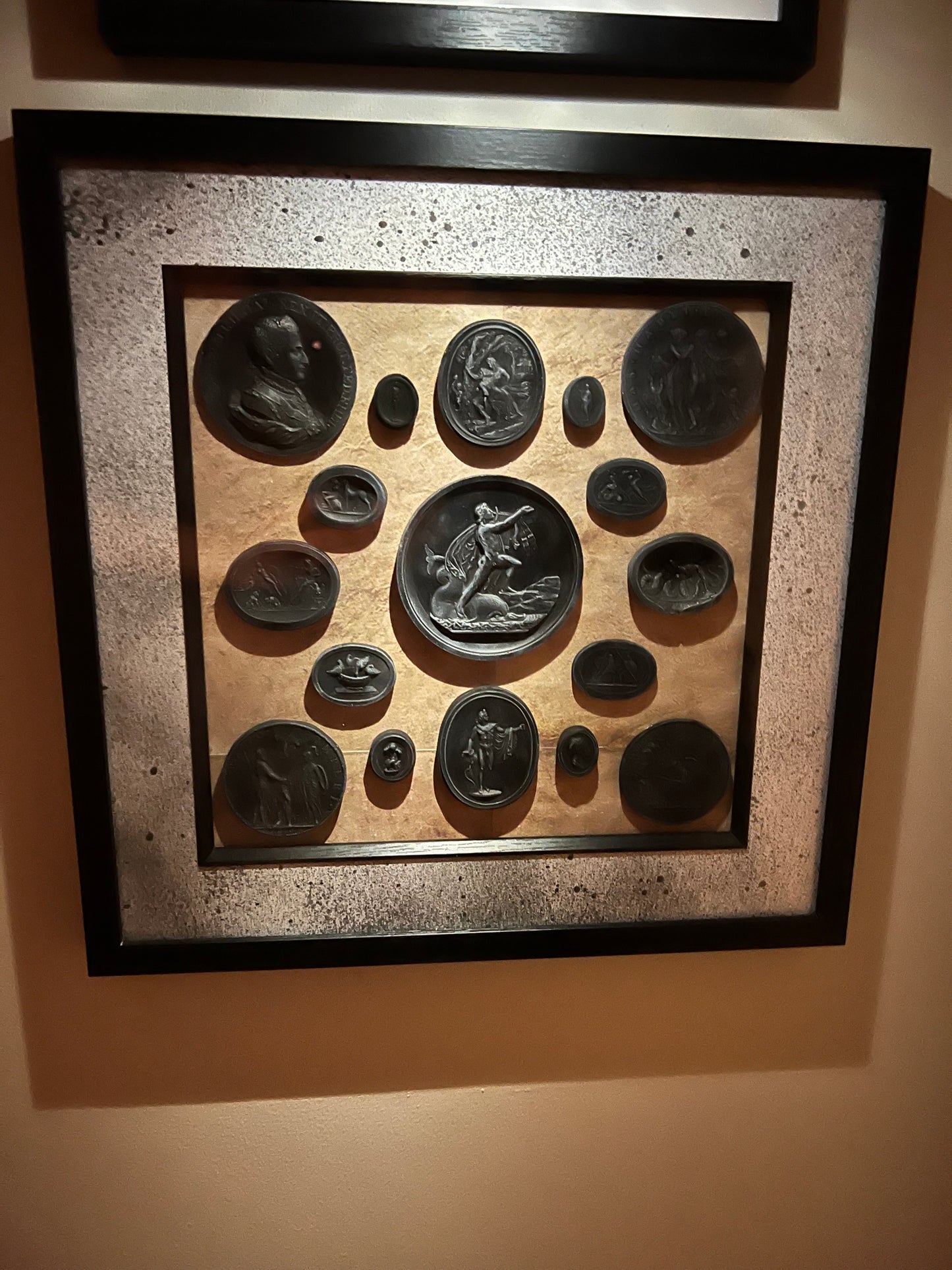 Black Intaglios On Papirus In A Black Frame