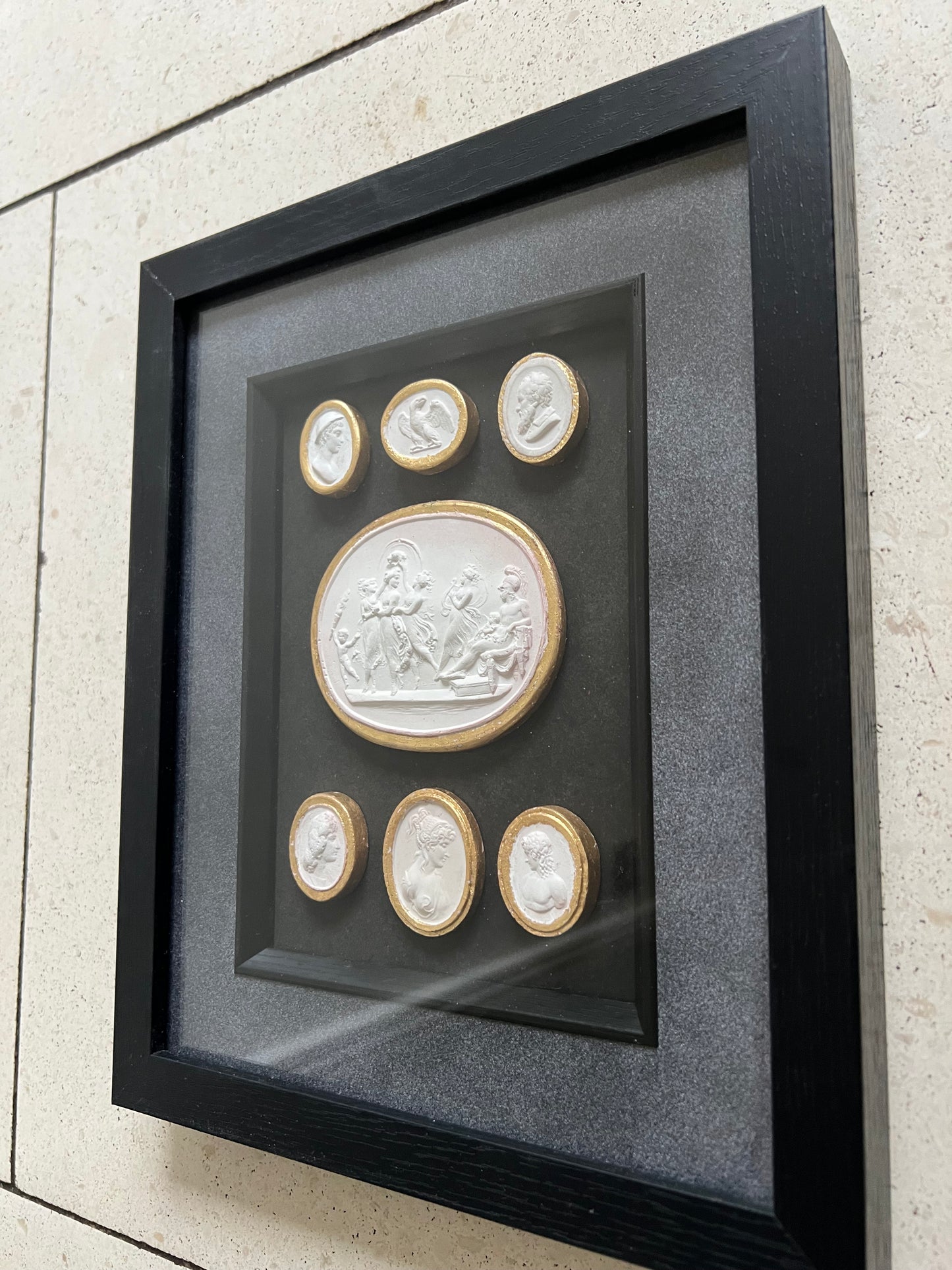 Set of Seven Intaglio's With Gold leaf And Black Frame